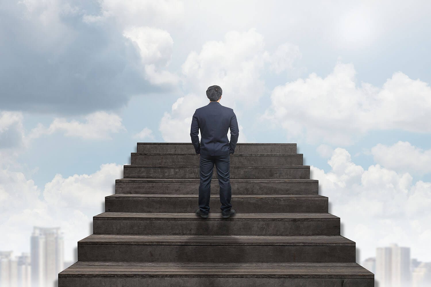 A Software Entrepreneur standing on top of a set of stairs.