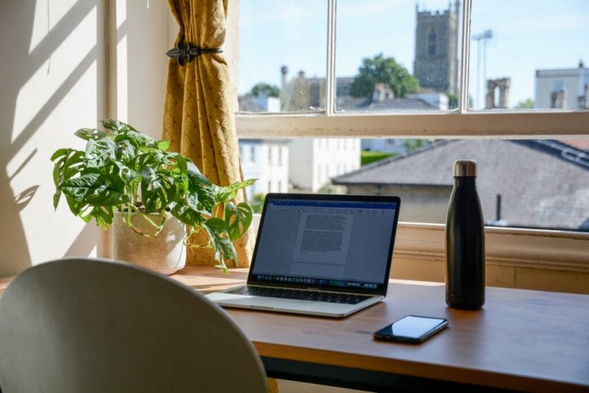 A Setapp laptop on a desk in front of a window, showcasing the vast options available in the Mac App Ecosystem.