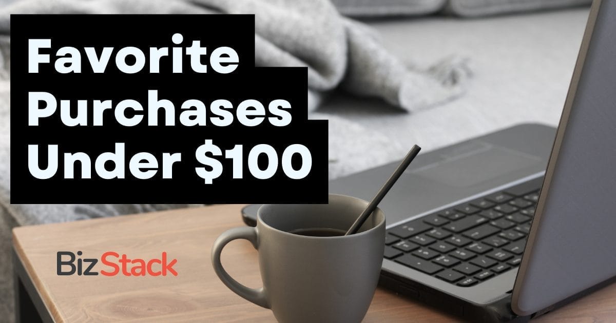 A solopreneur's laptop with a mug beside it featuring text overlay "favorite purchases under $100" by bizstack.