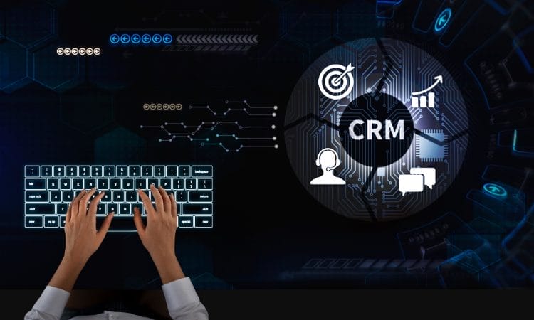 Hands typing on a keyboard with the best CRM interface featuring customer management icons projected in the background.